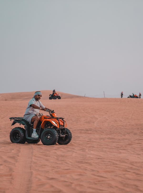 Experience the thrill of quad biking across vast desert dunes, perfect for adventure seekers.